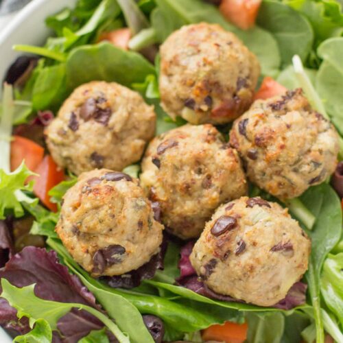 Greek Turkey Meatballs on a bed of spring mix.