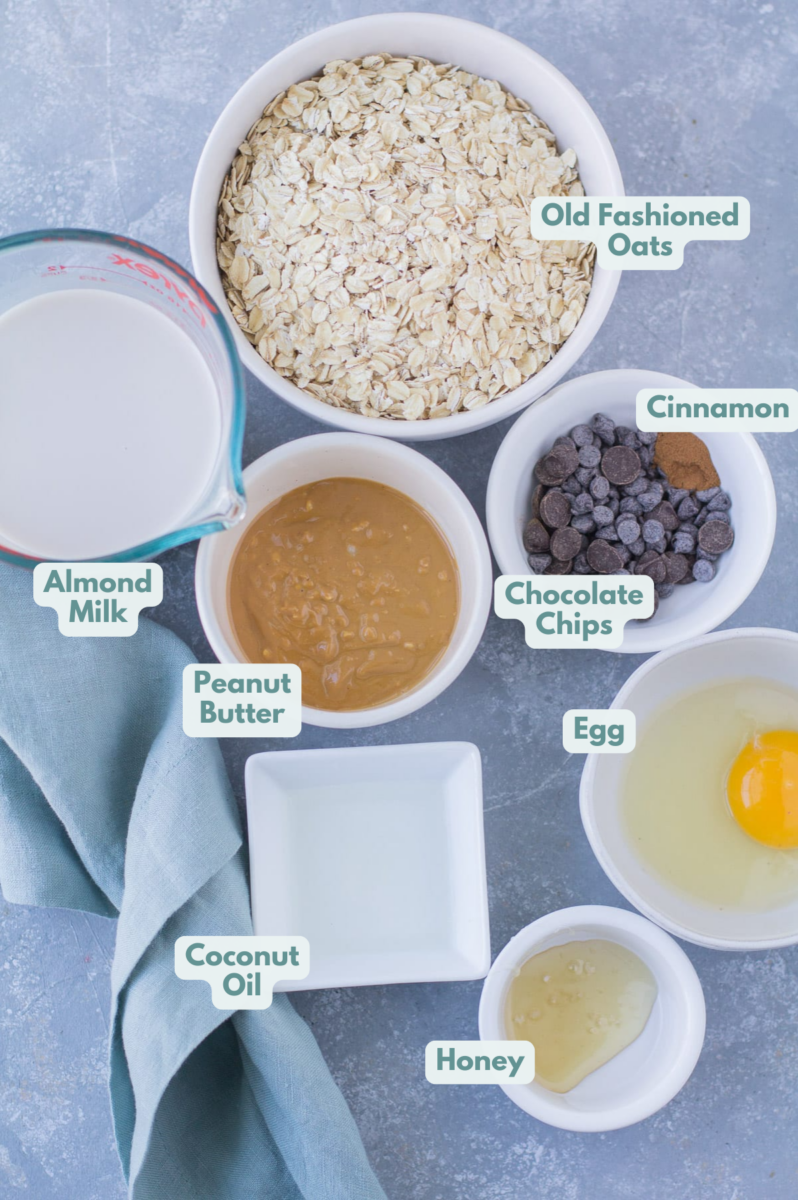 An overhead shot of Chocolate Peanut Butter Baked Oatmeal Ingredients in small white bowls