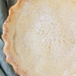 An overhead shot of an Italian Cream Pie on a grey background