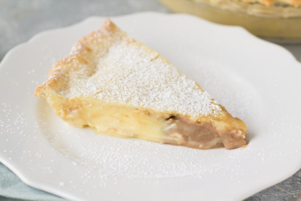 A side view of Italian Cream Pie on a white plate