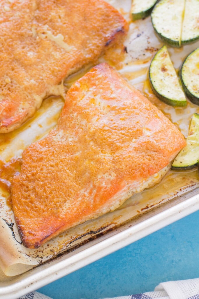 Honey sriracha salmon on a stainless steel baking sheet