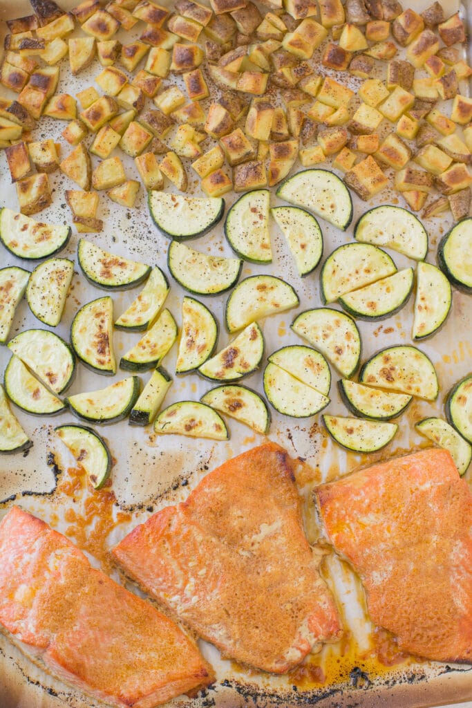 An overhead shot of honey sriracha salmon on a sheet pan