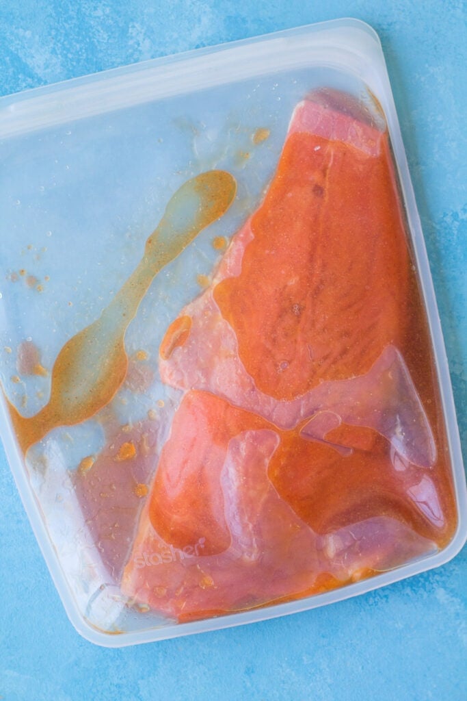salmon marinating in honey sriracha glaze