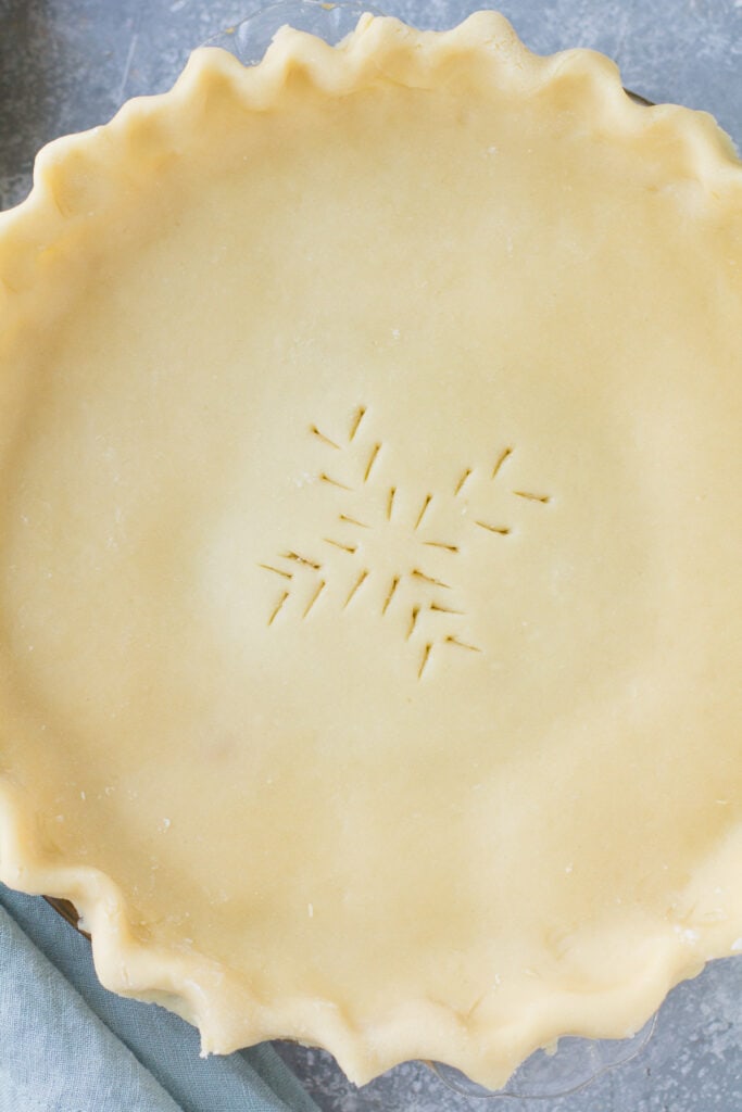 a close up of unbaked italian cream pie