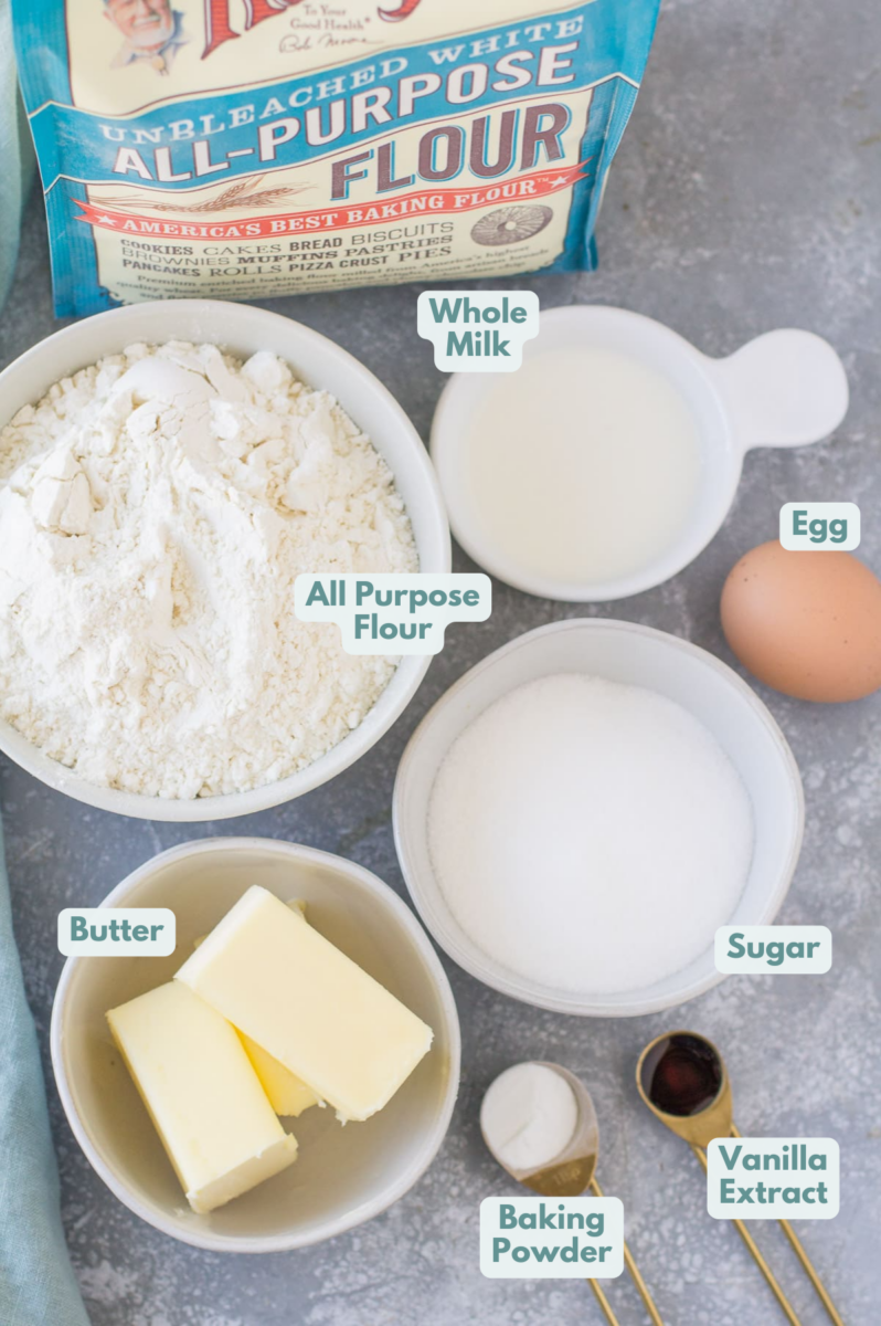 Ingredients for Italian Cream Pie on a grey background in small bowls on a grey background