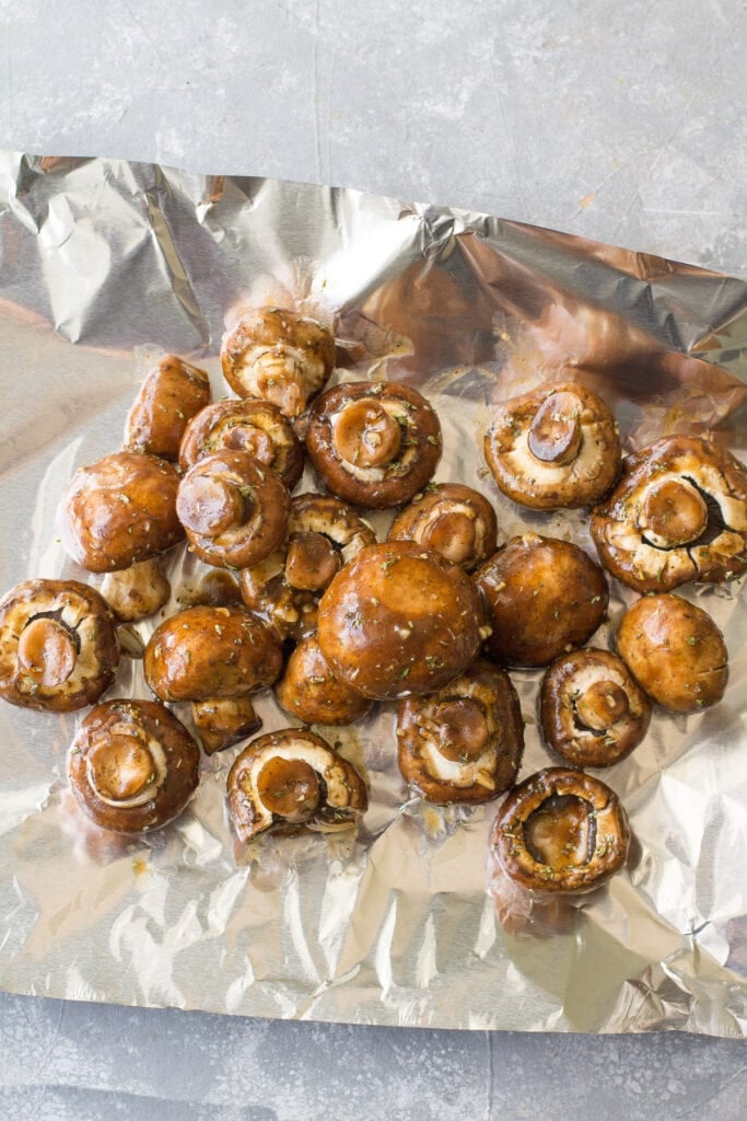 balsamic mushrooms on a piece of aluminum foil before grilling