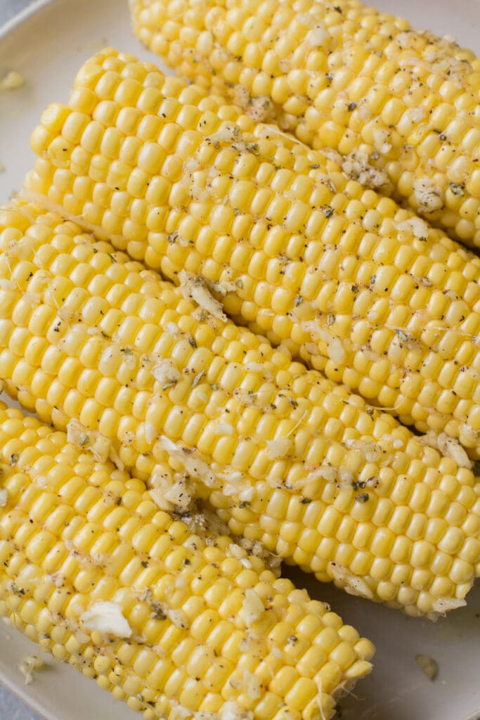 garlic parmesan corn before being grilled