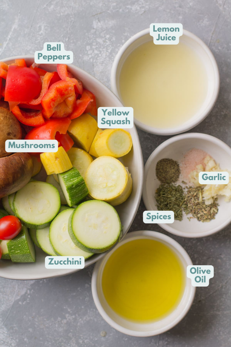 Ingredients for Grilled Vegetables in Foil - veggies, olive oil, lemon juice and spices in small white bowls