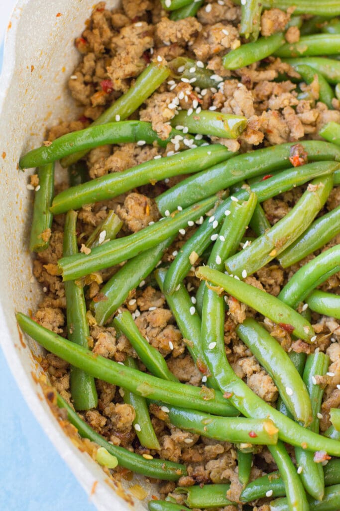 green beans being added in to ground turkey stir fry