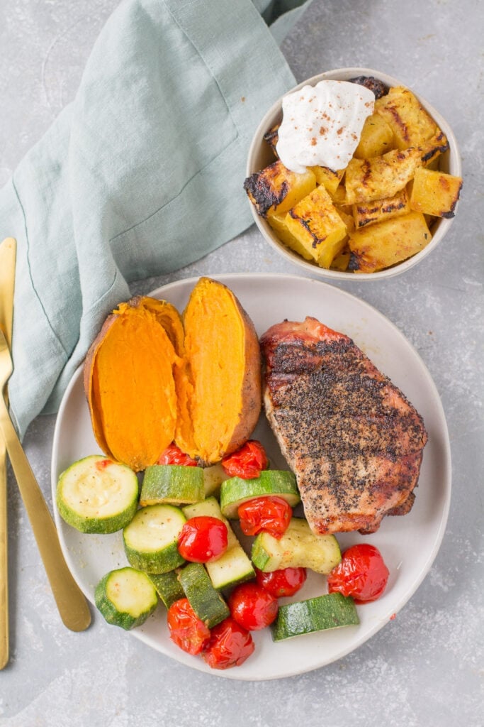 An overhead shot of a complete meal made on the grill