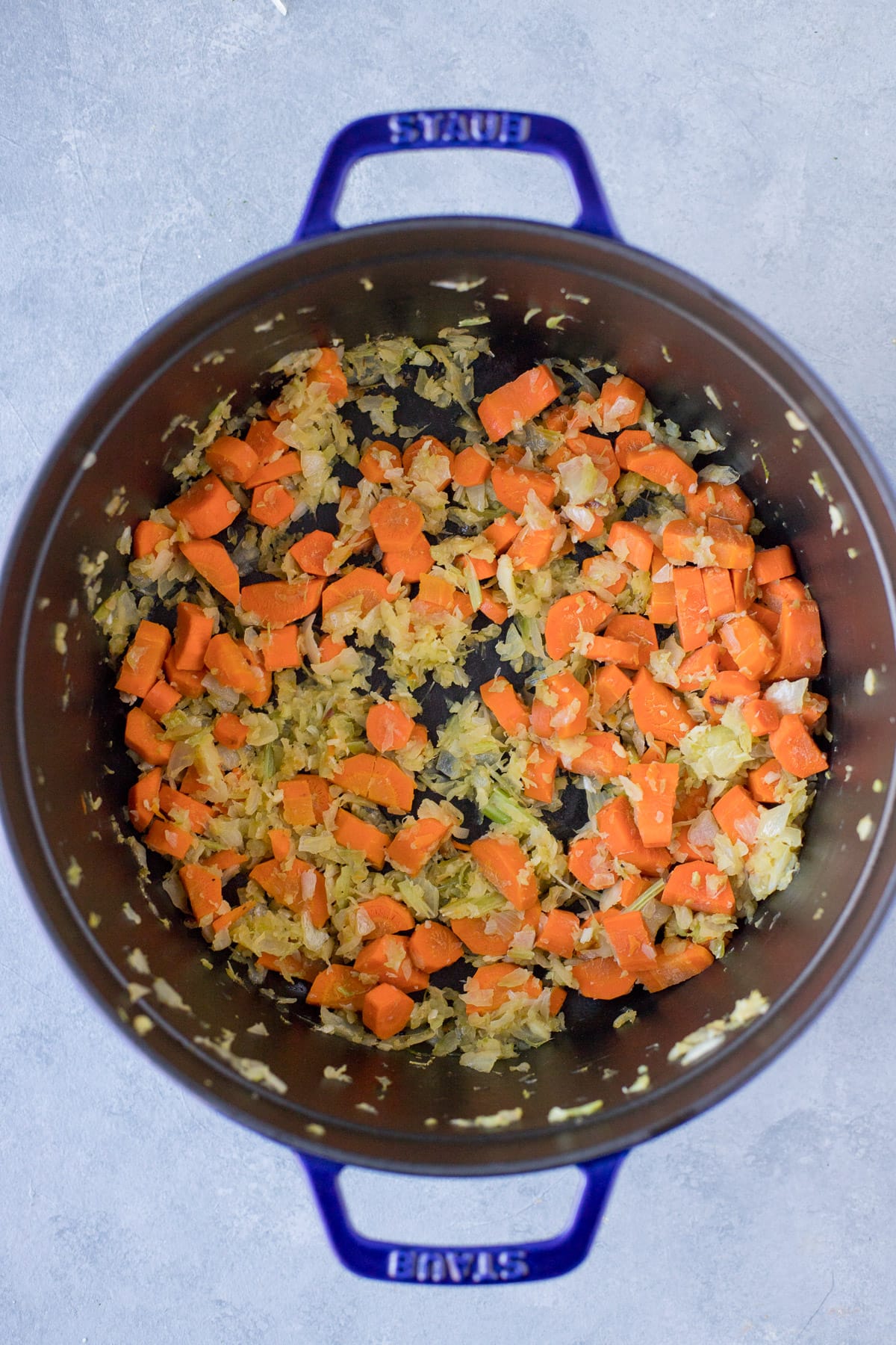 Onion, garlic, celery and carrots sauteing for leftover turkey soup