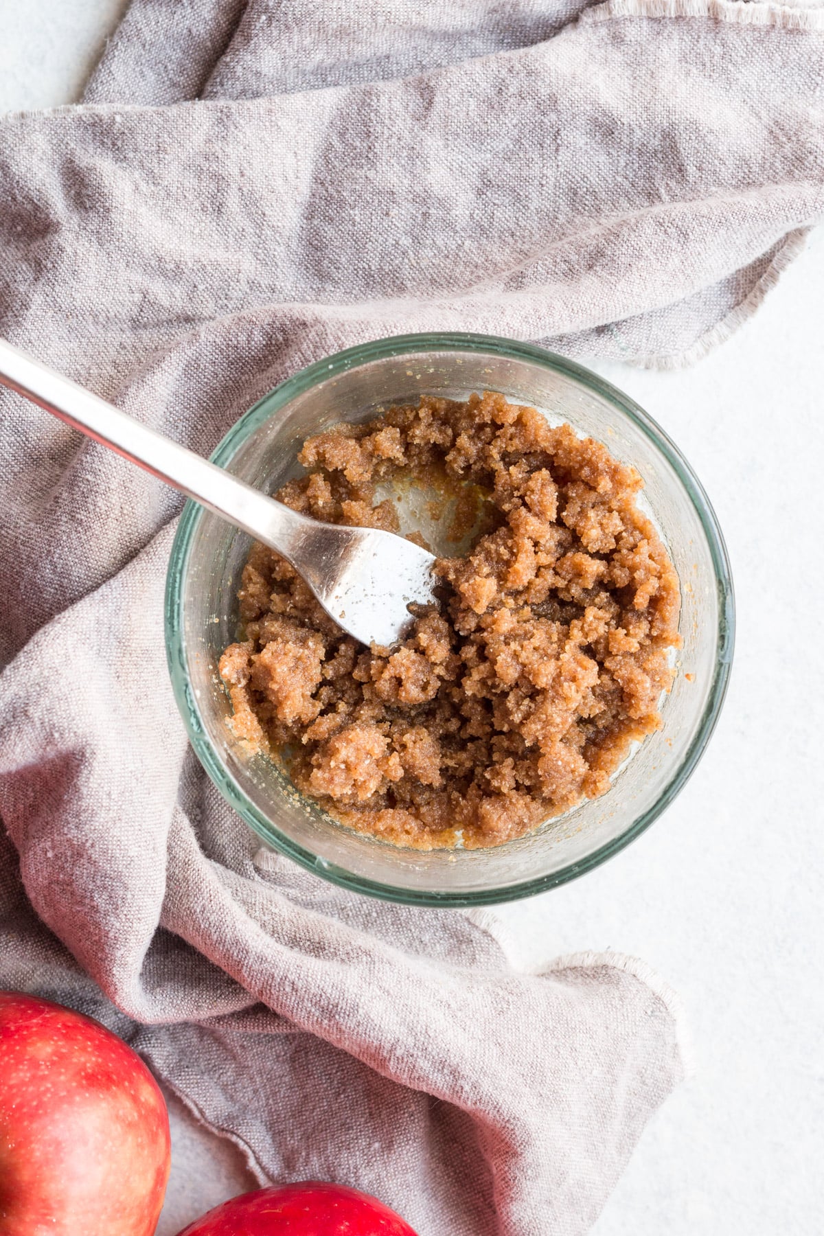 apple crumble bar topping being mixed together in a bowl