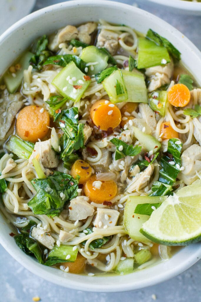 A close up of a bowl of healthy asian chicken soup