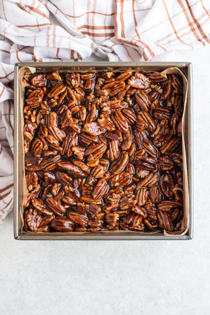Pecan pie bars in an 8x8 pan before cutting.