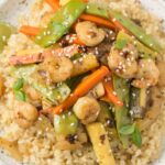 A close up of Healthy Shrimp Stir Fry on a white plate