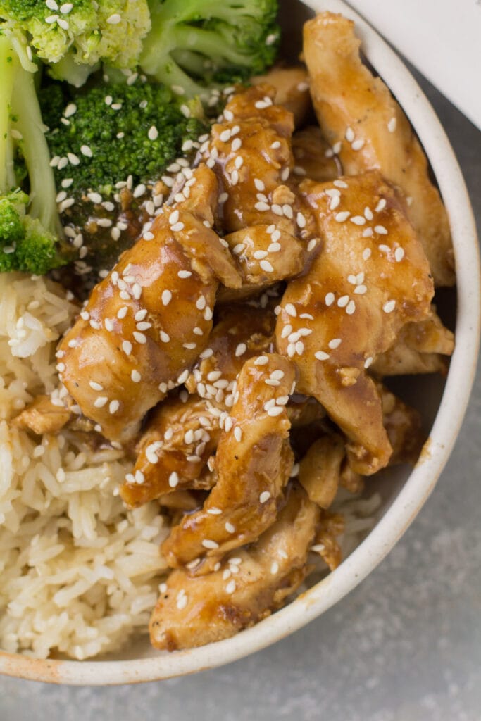 A close up of paleo chicken from Kevin's natural foods in a white bowl