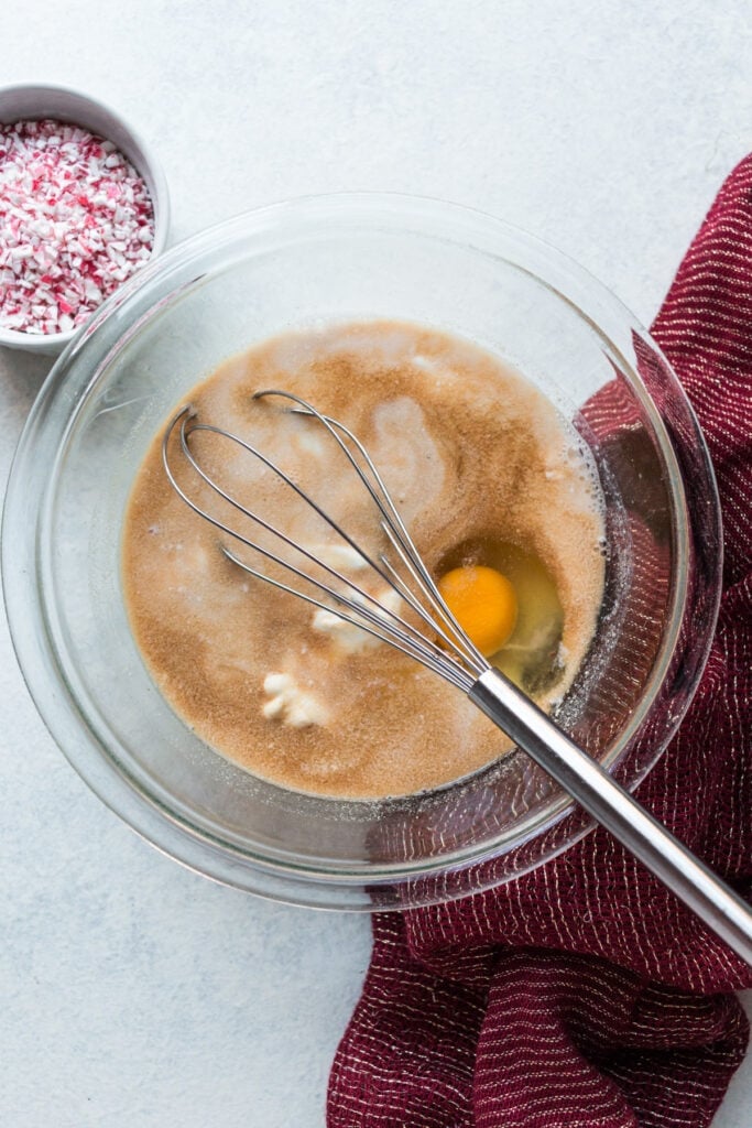 Wet ingredients for peppermint chocolate muffins being mixed together