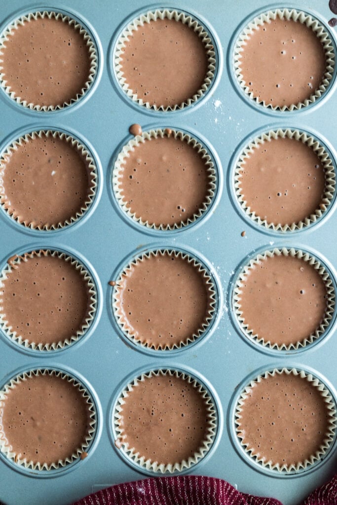 chocolate mint muffin batter in muffin tins before being baked
