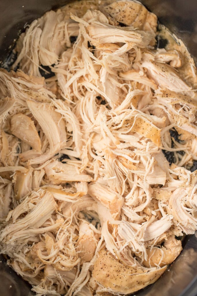 shredded chicken in black crockpot