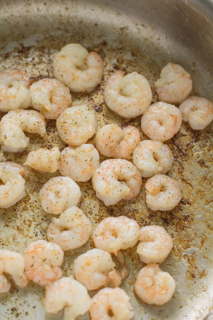 shrimp in a pan being seared for healthy shrimp stir fry