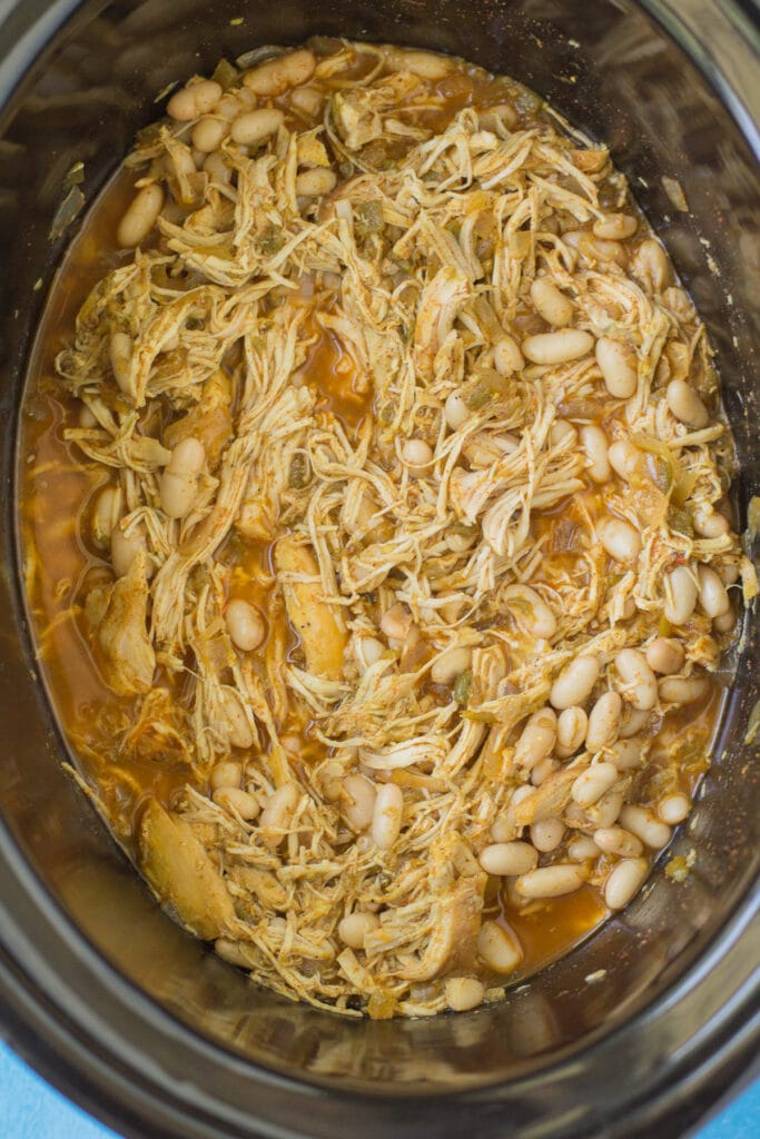 A close up of healthy chicken chili in a crockpot base