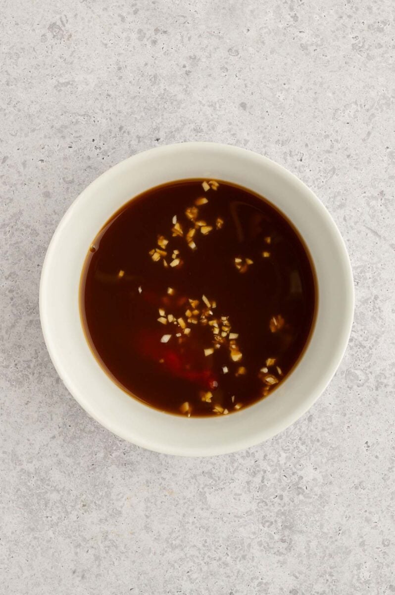 Sweet and sour chicken sauce in a bowl.
