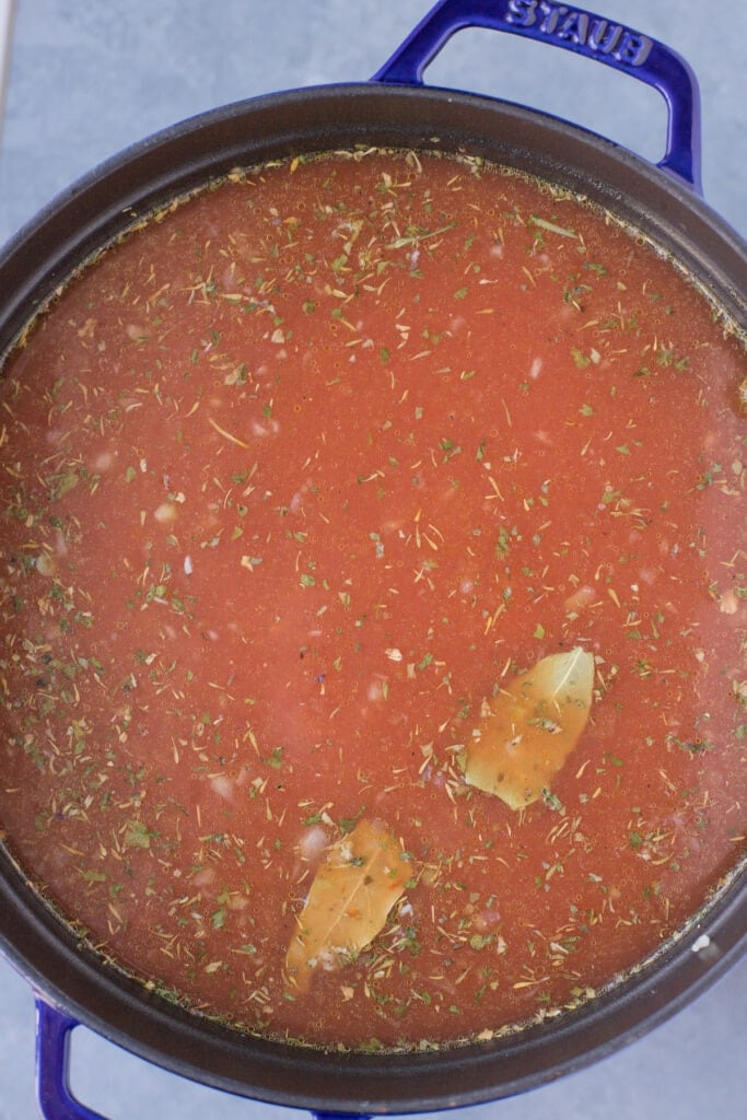 An overhead shot of easy lentil soup in a dutch oven before it starts to cook