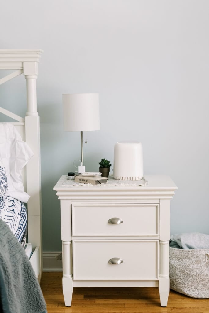 The canopy humidifier on a white nightstand in a bed room