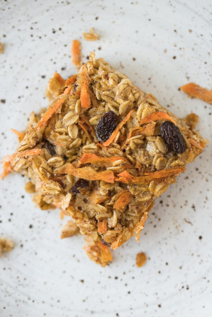 A close up of Carrot Cake Oats on a white speckled plate