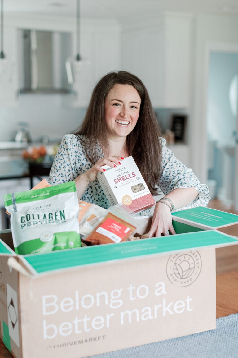 Healthy Pantry Staples Checklist - a girl opening a box of pantry staples