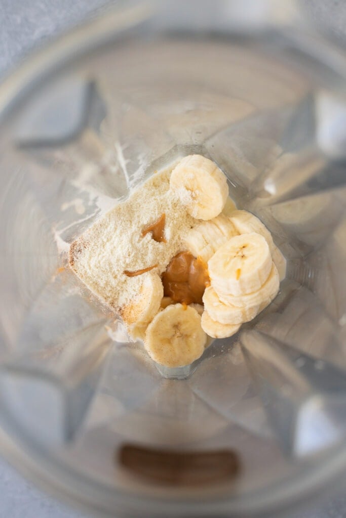Ingredients in a blender for a healthy banana smoothie