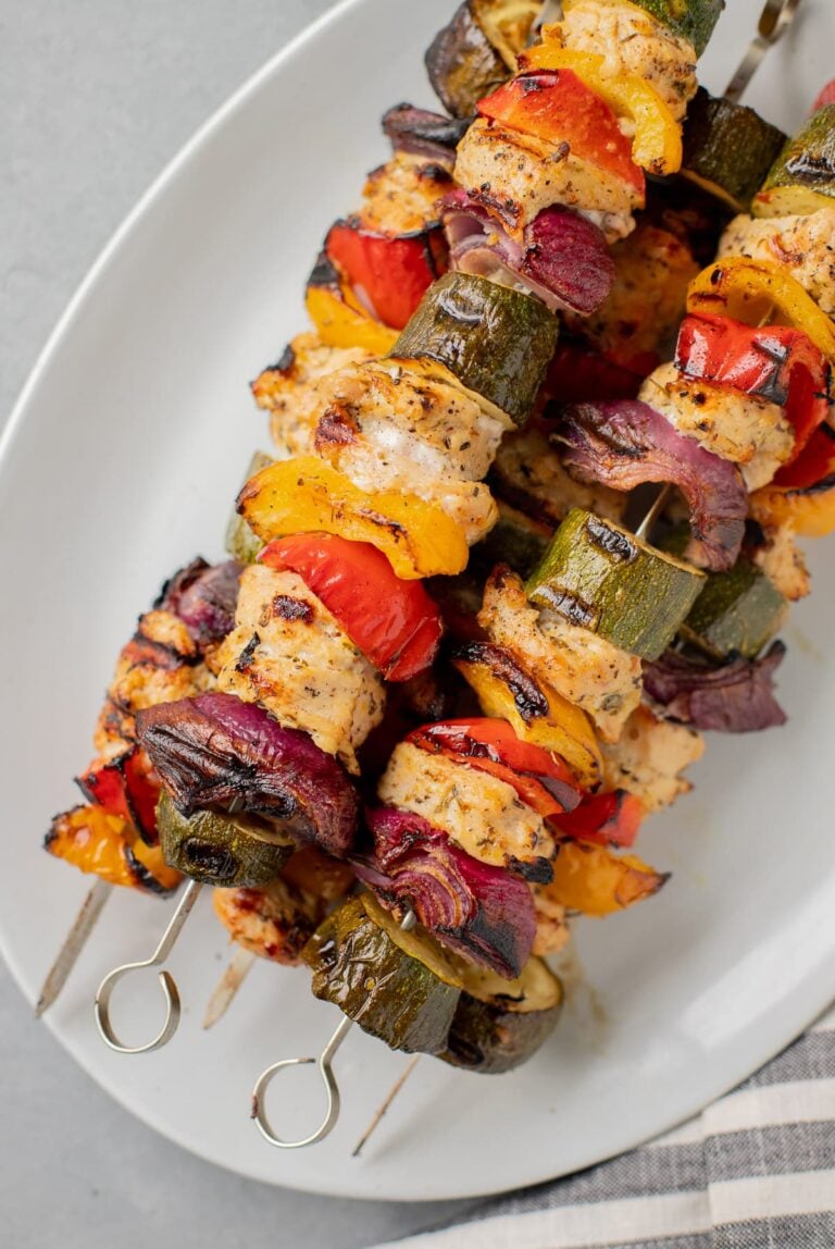 Greek Chicken Kabobs Recipe on a white platter after coming off of the grill