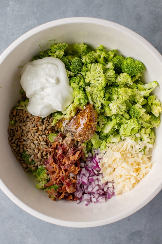 Healthy Broccoli Salad in a bowl segmented out before being mixed together