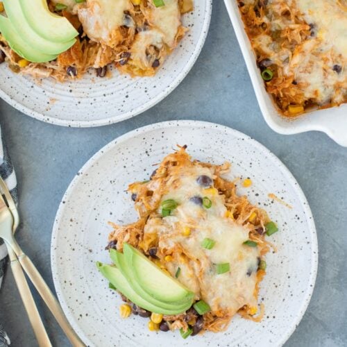 Spaghetti Squash Casserole on a white plate with a second dish and casserole dish off to the side