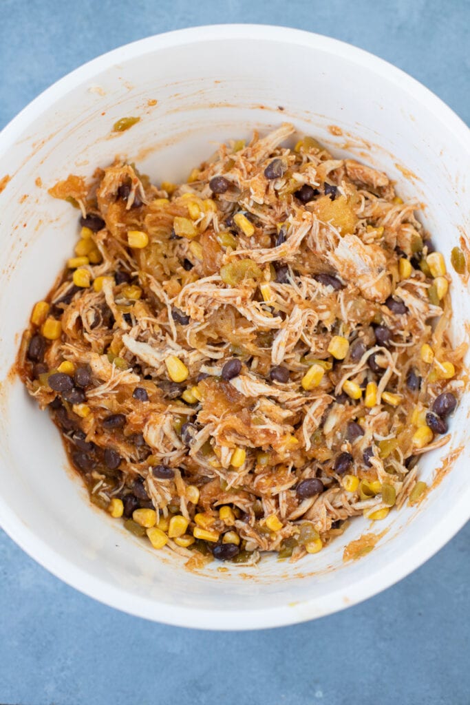 Ingredients for spaghetti squash casserole in a bowl after it's mixed together