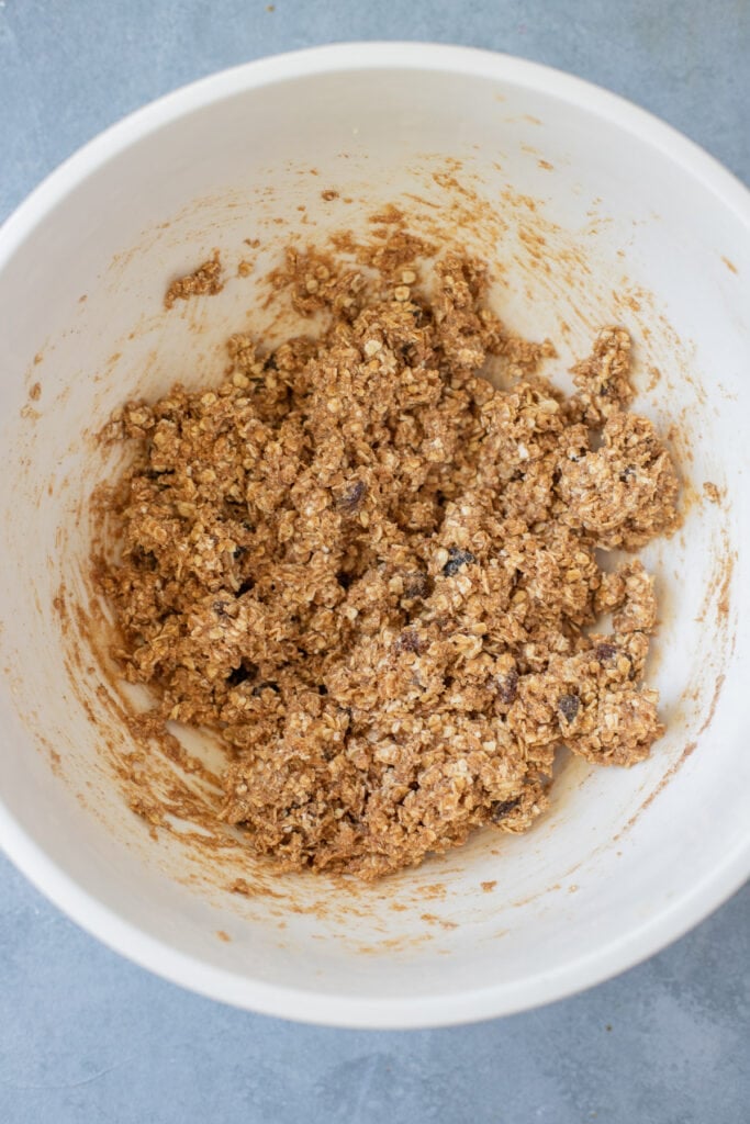 Batter for oatmeal raisin bars in a white bowl