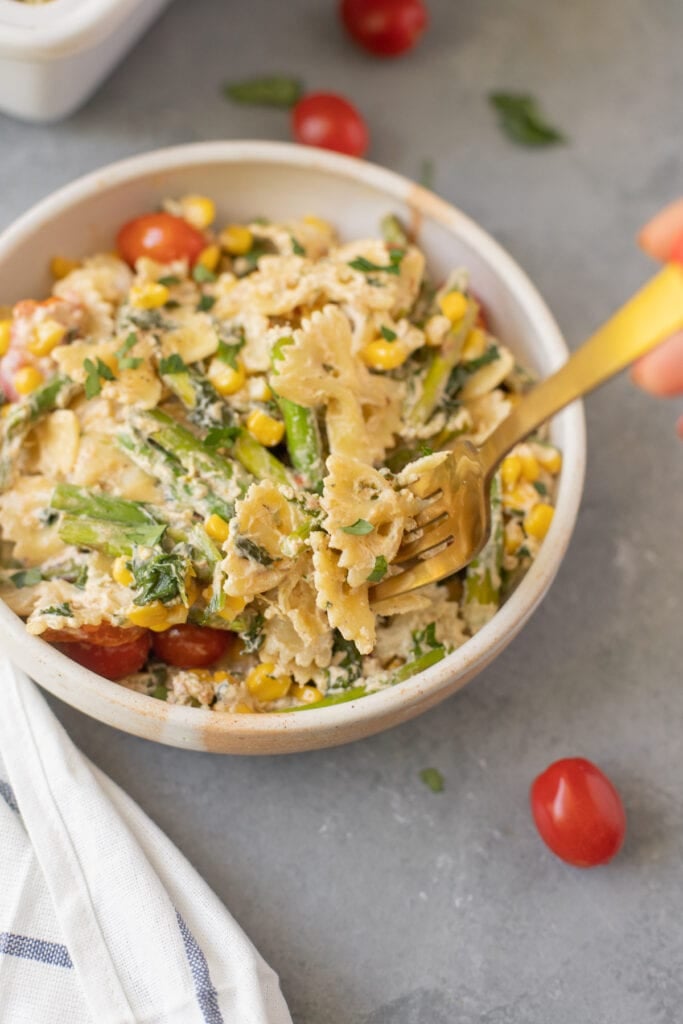 A fork taking a bite out of Goat Cheese Pasta