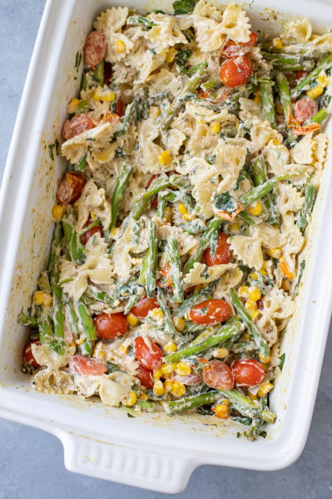 A close up of Goat Cheese Pasta in a large white baking dish