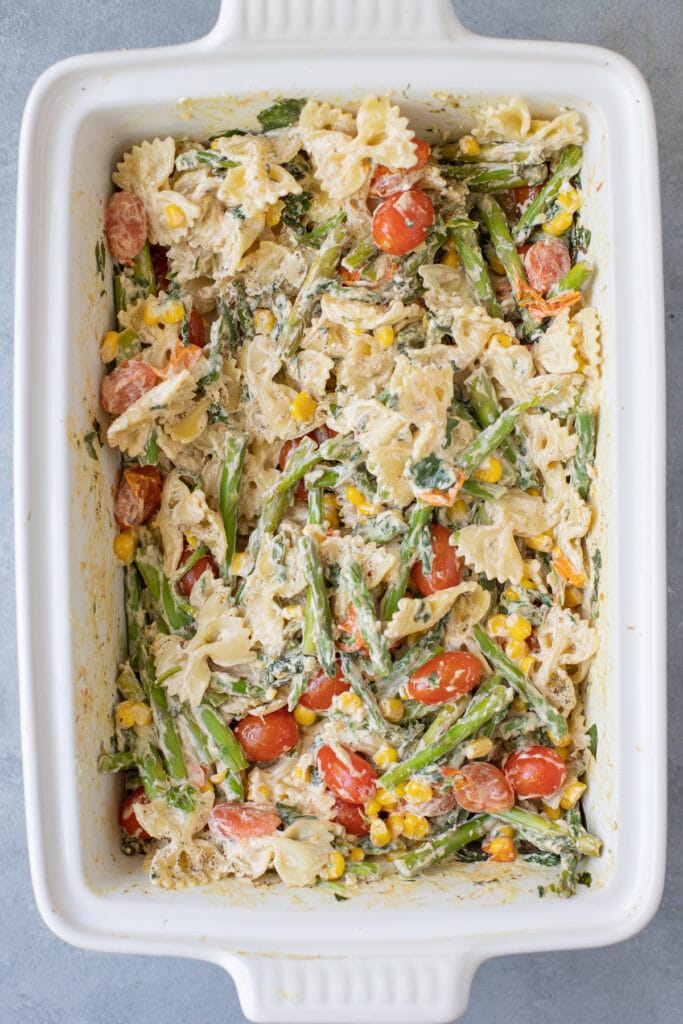 A large baking dish filled with goat cheese pasta