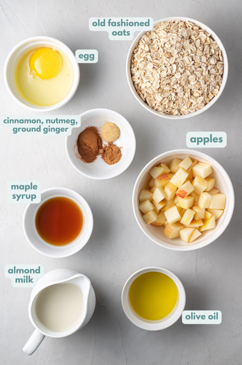 Baked Oatmeal Ingredients in small white bowls on a light grey background