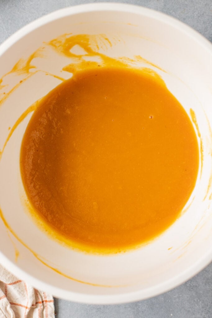 Wet ingredients for healthy pumpkin bread batter before flour has been added