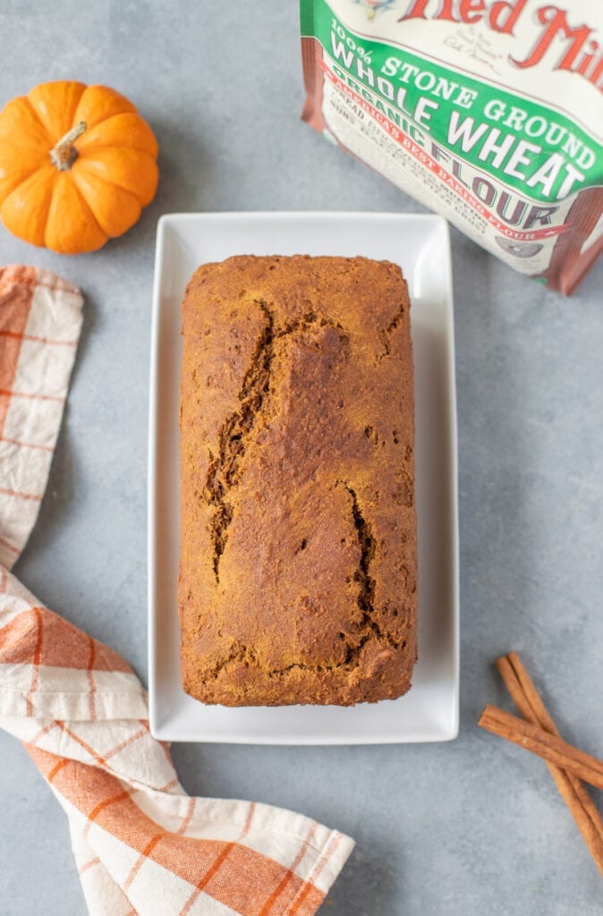 Healthy Pumpkin Bread fresh out of the oven on a white square dish