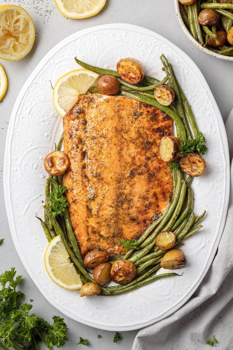 Lemon Salmon on a white plate with ingredients off to the side