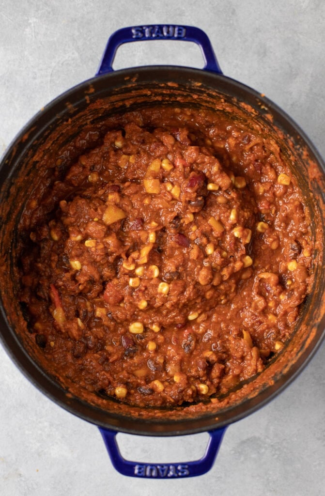 A close up of vegetarian chili when it's finished cooking in a dutch oven