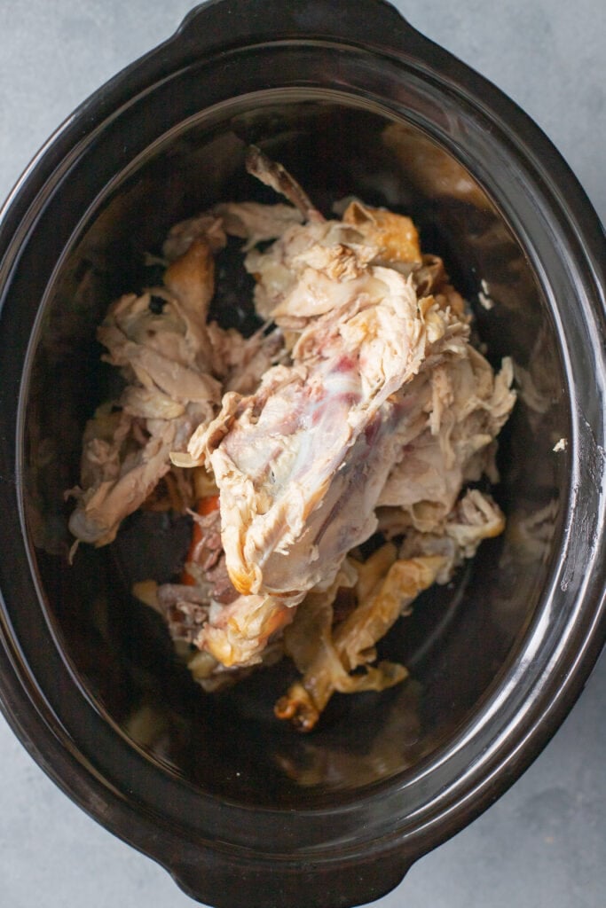 A collage showing how to make homemade chicken broth. Raw chicken scraps in a crockpot