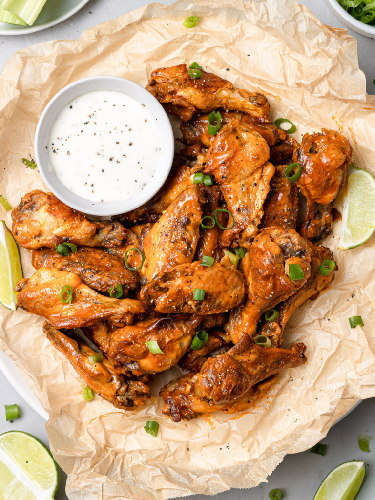 Overhead shot of Crock Pot Chicken Wings on a platter with ranch on the side
