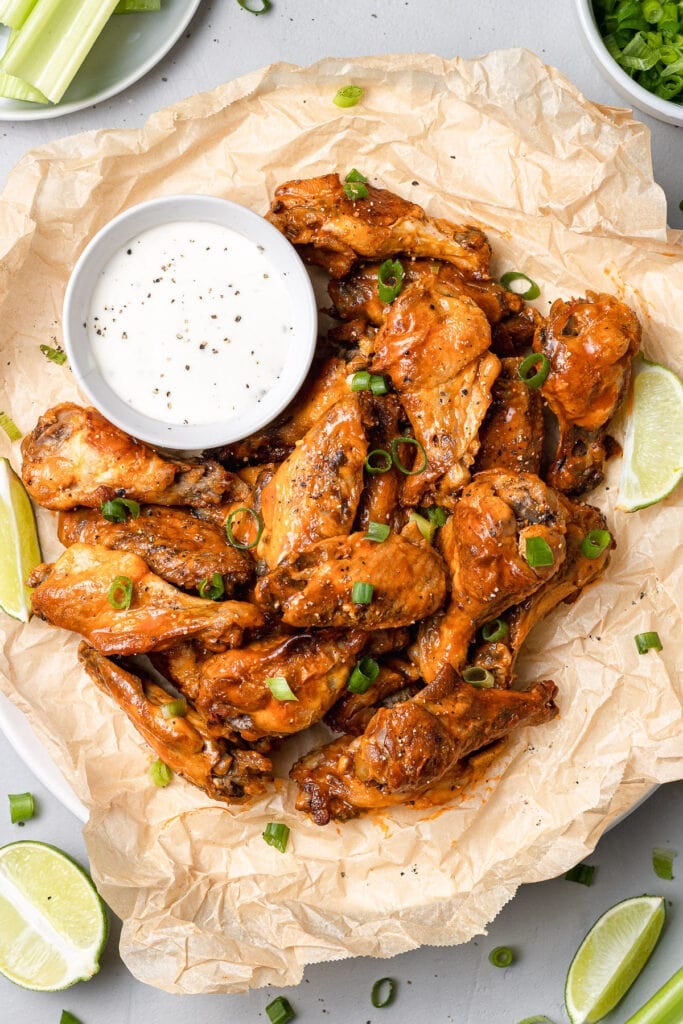 Overhead shot of Crock Pot Chicken Wings on a platter with ranch on the side