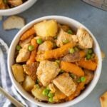 An overhead shot of instant pot chicken stew on a grey background