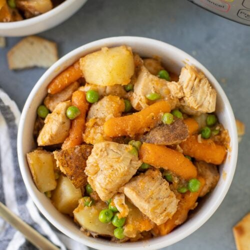 An overhead shot of instant pot chicken stew on a grey background