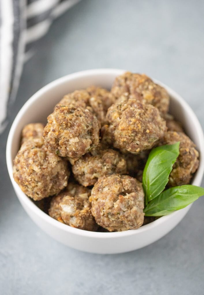 A close up of the best homemade meatballs in a grey bowl